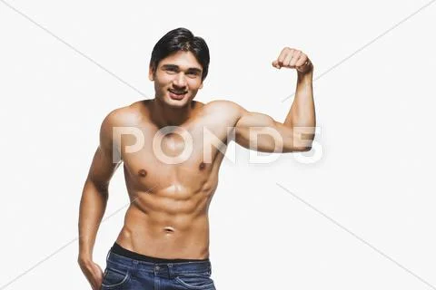 Portrait of a man showing his biceps Stock Photos