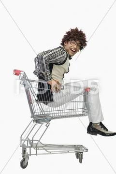 Portrait of a man sitting in a shopping cart Stock Photos