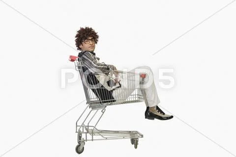 Portrait of a man sitting in a shopping cart Stock Photos