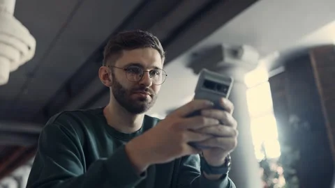 Portrait Of Man With Smartphone In Restaurant, Internet Addicted Male Person Video stock 343668960