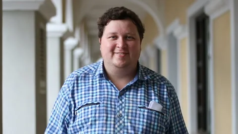Portrait of man smiling and looking at camera. Face of a fat man wearing plaid Stock Footage 92935378