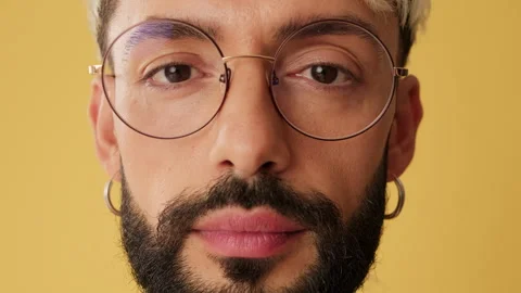 Portrait, man smiling looking at camera isolated on yellow background in studio Stock Footage 253935551