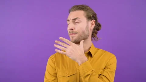 Portrait of a man spreading over a proposal on an isolated purple background Video stock 149044359