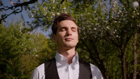 Portrait of a man in a spring forest. Slow motion Stock Footage 89297572