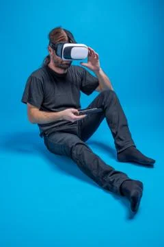Portrait of a man standing down preparing the telephone box for the VR device Stock-Fotos