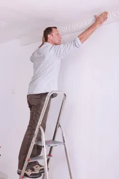 Portrait of a man on stepladder Stock Photos