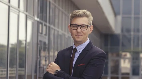 Portrait man in suit in front of office building. Handsome businessman outdoor Stock Footage 113763243