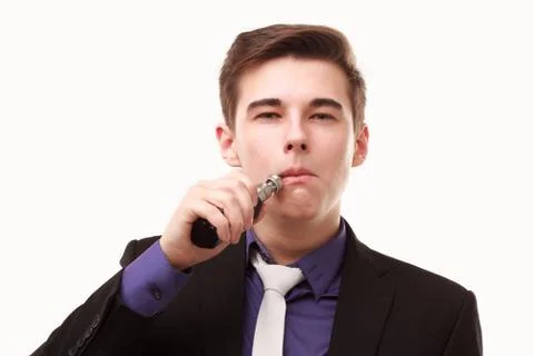 Portrait of a man in suit smoking an e-cigarette Stock Photos