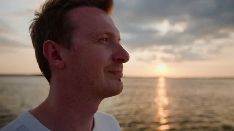 Portrait of a man at sunset while walking on a yacht Stock Footage 201192489