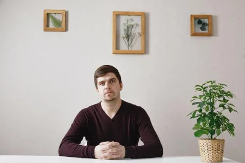Portrait of a man at the table. Stock Photos