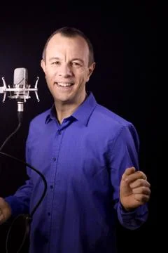 Portrait of man talking on microphone Stock Photos