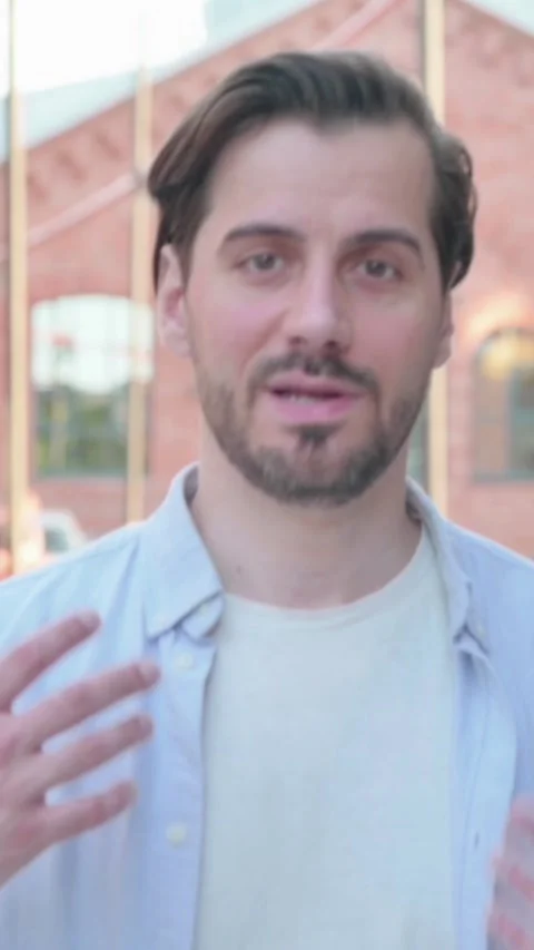 Portrait of Man Talking on Online Video Call Outdoor, Vertical Video Stock Footage 339666084