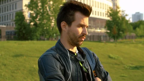 Portrait of a man talking in the park Stock-Footage 114577657