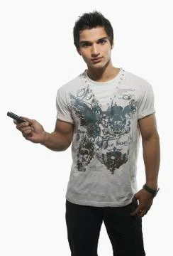 Portrait of a man text messaging on a mobile phone Fotos Stock