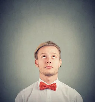 Portrait of a man thinking looking up Stock Photos