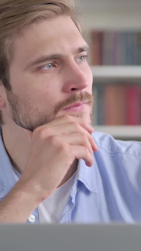 Portrait of Man Thinking while Working on Laptop, Vertical Video Stock Footage 339578989