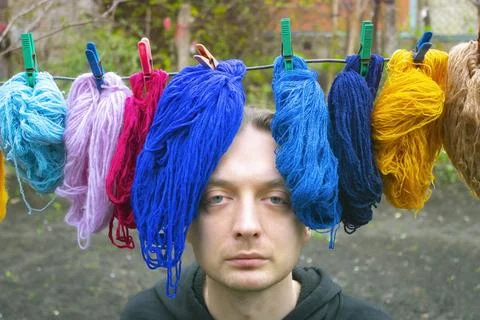 Portrait man with threads, woolen yarn Stock Photos