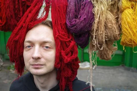 Portrait man with threads, woolen yarn Stock Photos