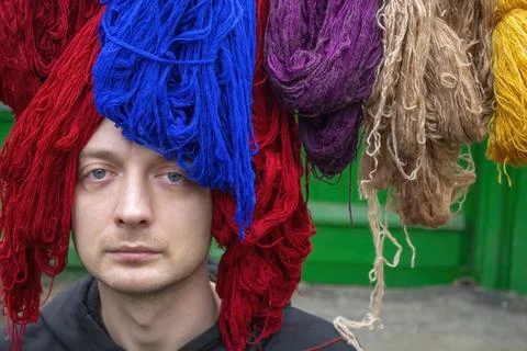 Portrait man with threads, woolen yarn Stock Photos