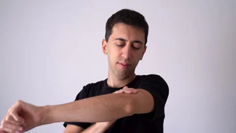 Portrait Of A Man Touching His Elbow In Pain. Close-up Shot Stock Footage 304940861