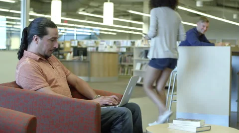 Portrait of man using laptop in the library Stock-Footage 67365093