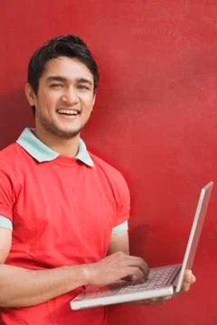 Portrait of a man using a laptop Stockfoto's