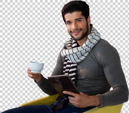Portrait of man using tablet while having tea on seat Stock Photos