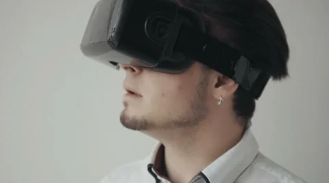 Portrait of Man Using Virtual Reality Glasses. Isolated on White Bckground Stock Footage 62544998