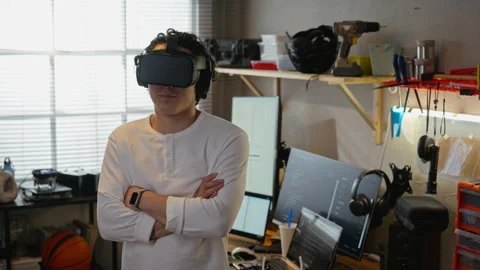 Portrait of Man Wearing Vr Headset in Tech Workshop with Arms Crossed Stock Footage 338424082