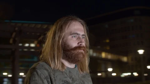 Portrait of a man while spinning on blurred background 動画素材 112524335