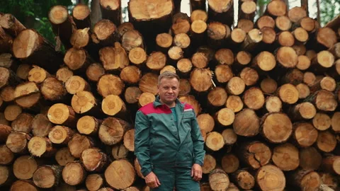 Portrait man in work clothes standing near a tree. Stock Footage 233905174