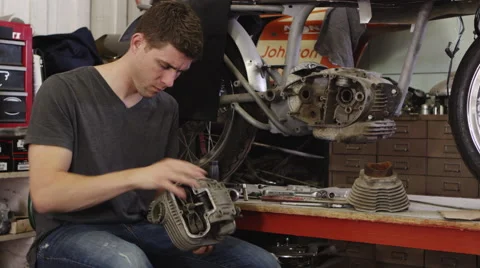Portrait of man working on motorcycle Video stock 67346284
