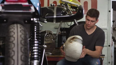 Portrait of man working on motorcycle Stock-Footage 67346455