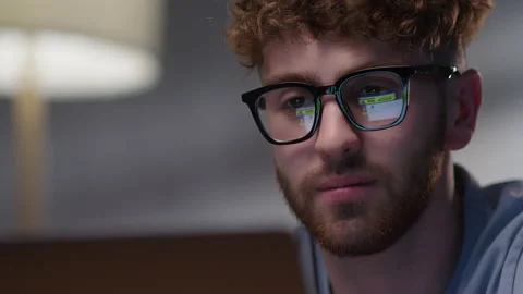 Portrait of Man Working at Night Looking at Monitor, Reflections in Eyeglasses Stock Footage 165073976