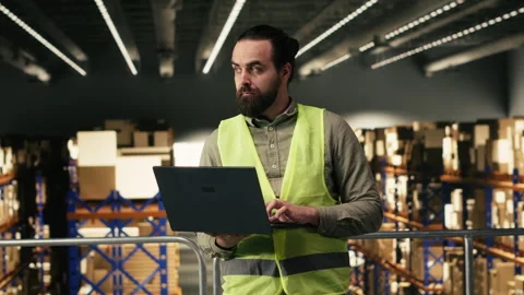 Portrait of man working in warehouse distribution center Stock Footage 330140468