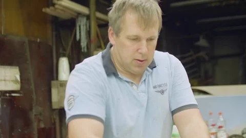 Portrait of man working in workshop. Interesting useful hobby Stock Footage 99573003