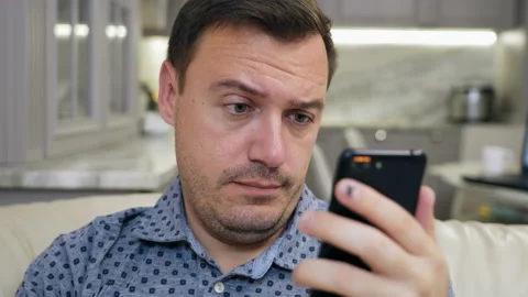 Portrait of manager cringe and looking at phone screen, bad joke or Stock Footage 169134231
