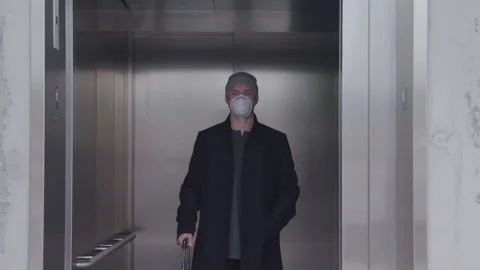 Portrait of a Masked Man Inside an Elevator Stockbeeldmateriaal 208777302