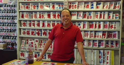A portrait of a master craftsman and painter of bus signs in Hong Kong. Shot on Stock Footage 201094057