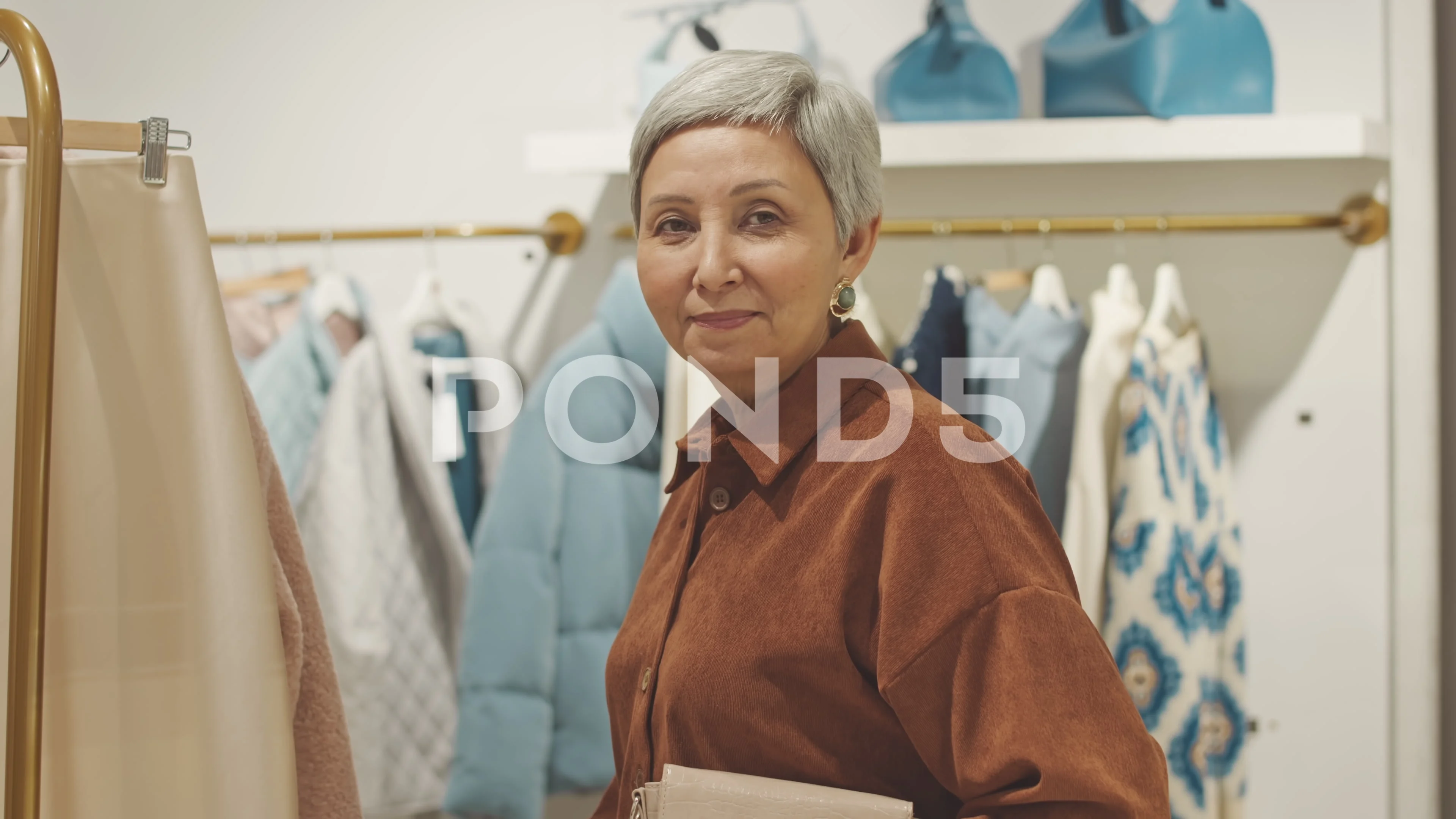 Portrait of Mature Asian Woman Shopping in Fashion Boutique