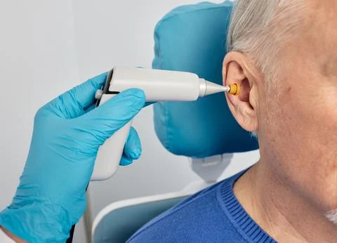 Portrait of mature man while tympanometry and test of middle-ear function w.. Foto stock