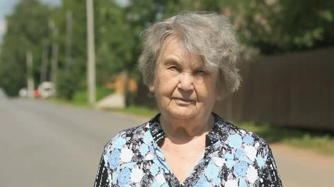 Portrait of mature old gramma outdoors Stock Footage