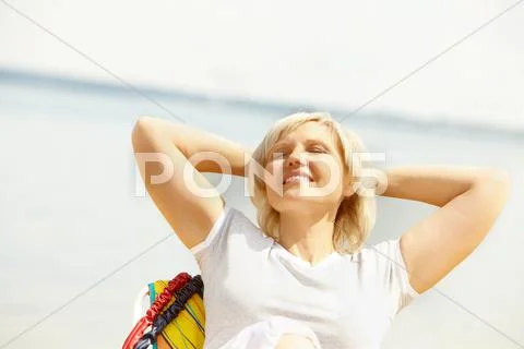 Portrait of a mature woman resting in chaise lounge Stock Photos
