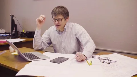 Portrait of middle-aged architect working in the office 스톡 동영상 83592978