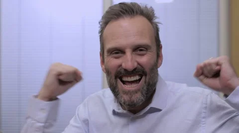 Portrait of Middle aged businessman checking online account celebrating Stock Footage 68614933