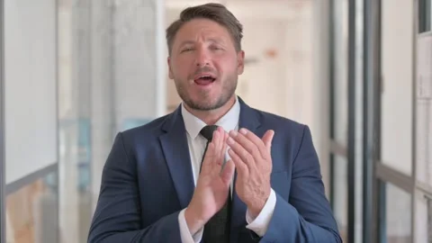 Portrait of Middle Aged Businessman Clapping for Team Stock-Footage 304651252