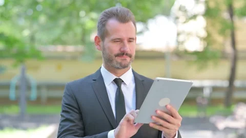 Portrait of Middle Aged Businessman Using Tablet Outdoor 스톡 동영상 287931140