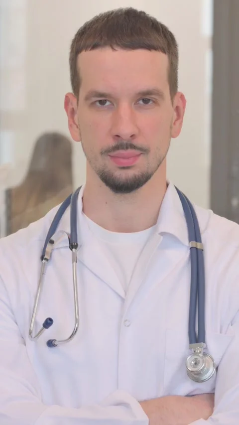 Portrait of Middle Aged Doctor Doing Thumbs Up, vertical video Video stock 325564581