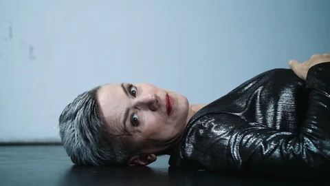 Portrait of Middle Aged Female Dancer Lying on Stage Floor Stock Footage 121107879