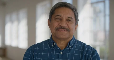 Portrait of middle aged hispanic man smiling confident looking at camera Stock Footage